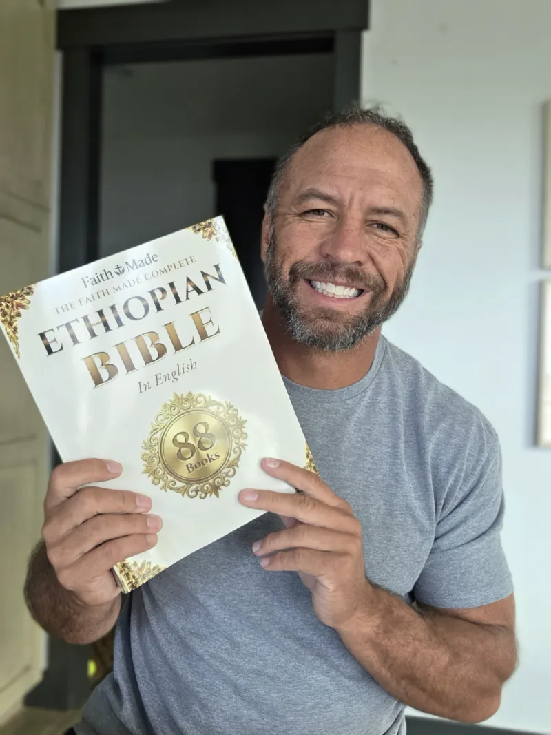 Matt K. holding The Faith Made Complete Ethiopian Bible